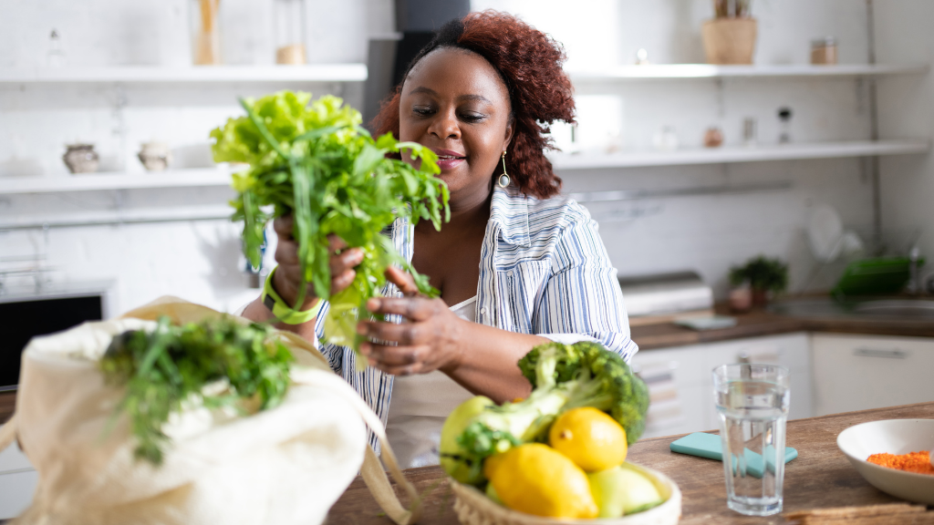 Woman holding vegetables